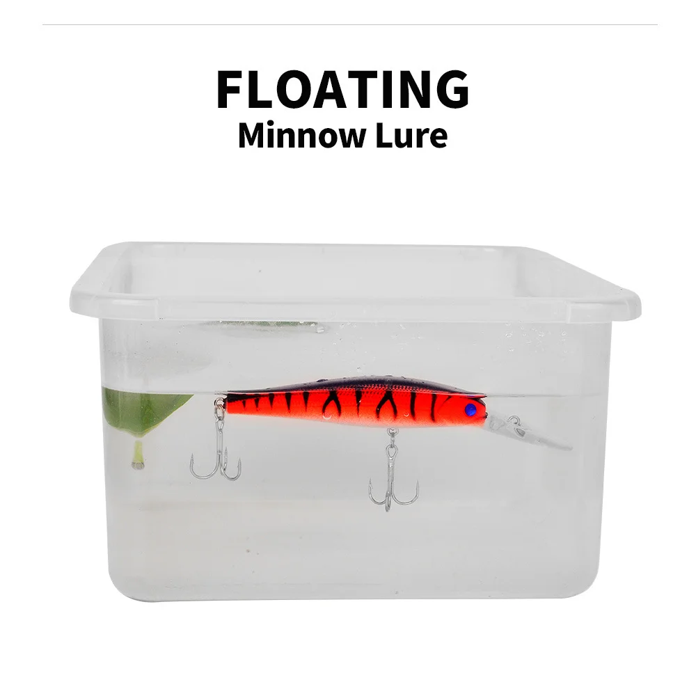 Floating minnow lure shown floating in a water tank