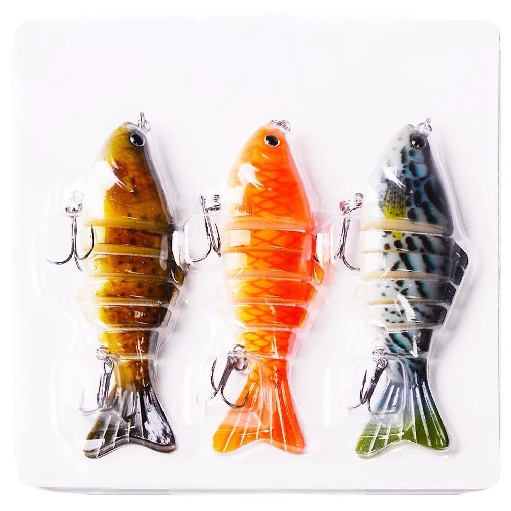 Three colorful segmented swimbaits in blister packaging