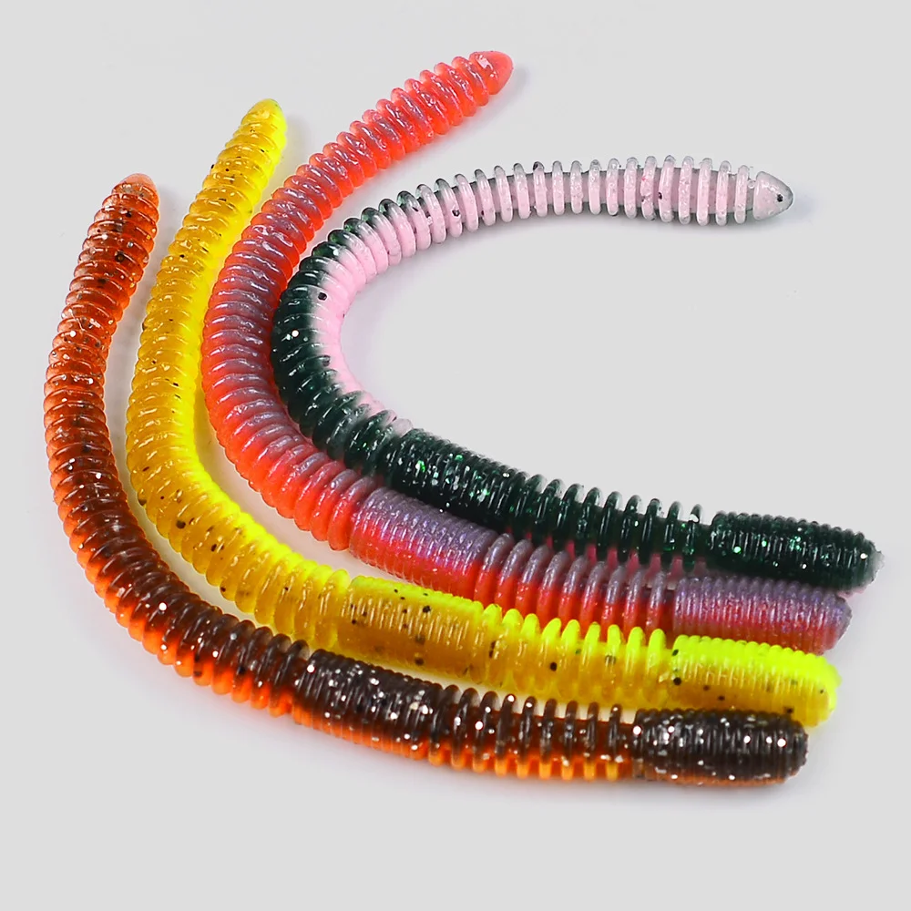 Hands stretching the worm lure to demonstrate high elasticity and resilience 