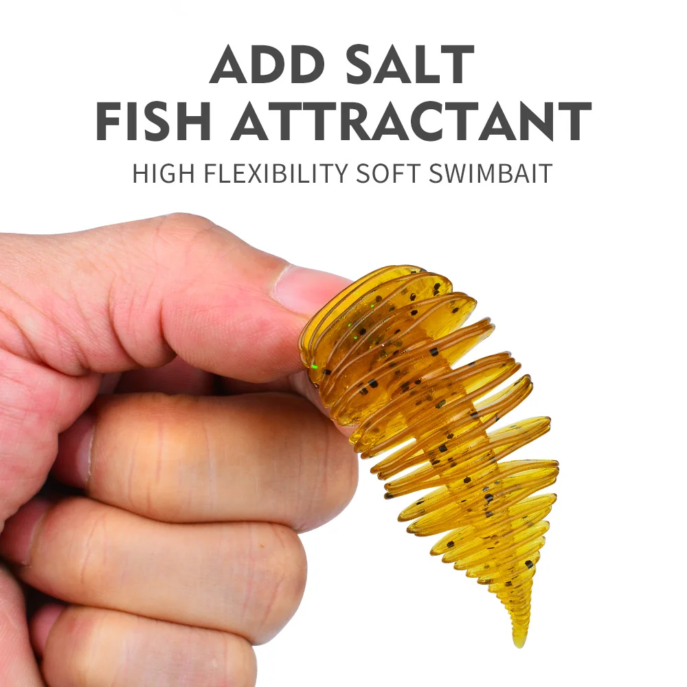 Hand holding a gold lure, emphasizing salt attractant for enhanced fish targeting