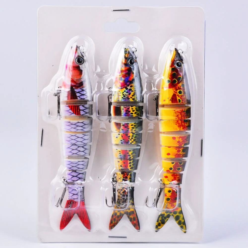 Three fishing lures in blister packaging with vibrant body colors