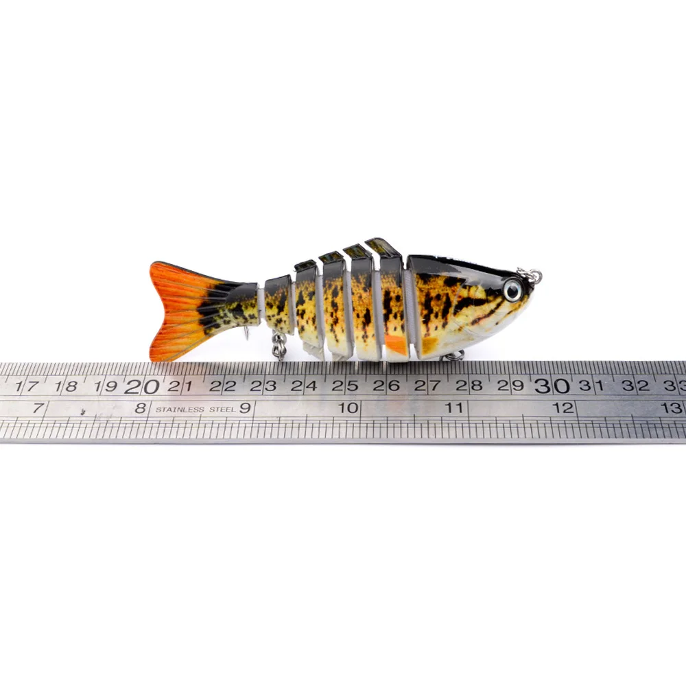  Lure placed next to a ruler for accurate measurement, confirming 10cm length.