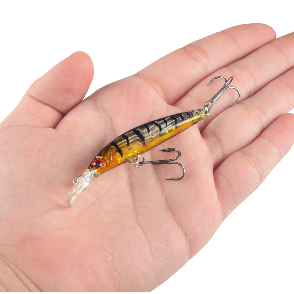 LureZ Bolt Fishing Lure in hand, displaying size and hooks