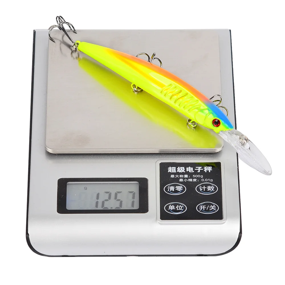 Digital scale showing lure weight of 12.57g with yellow-colored lure on top