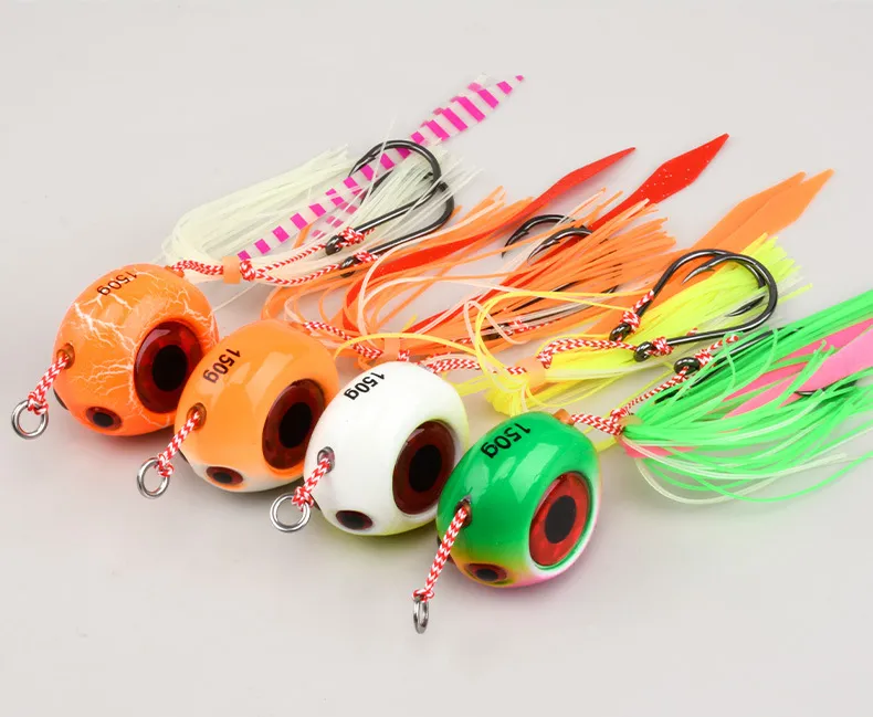 Assorted slow jigging lures with silicone skirts in orange, green, and white colors